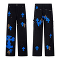Black carpenter pants with blue cross patches