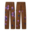 Brown carpenter pants with purple and navy cross patches