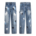 Blue denim carpenter pants with white, sky blue and black cross patches