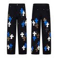 Black carpenter pants with blue, white and leopard cross patches