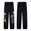 Black carpenter pants with multicolour sticker graphic patches