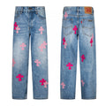 Light wash denim with pink and magenta cross patches