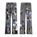 Grey paint splatter flare denim with multicolour cross patches