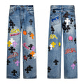 Blue denim with black cross patches and sticker graphic appliques