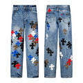 Multicolour cross patch jeans in mid blue