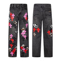 Pink cross and skull patch jeans in washed black