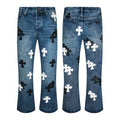 Black and white cross patch jeans in vintage blue
