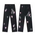 Pink and checkerboard cross patch jeans in black